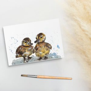 Foto van ansichtkaart met aquarelschildering van eendjes in het water
