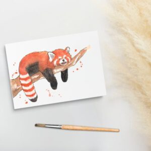 Foto van een ansichtkaart met aquarel schildering van een rode panda