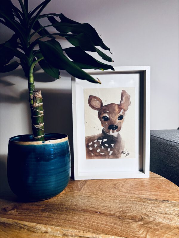 Foto van de bambi poster in een fotolijstje