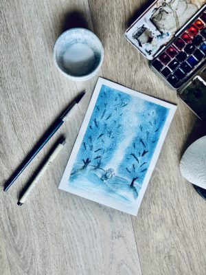 Foto van een aquarelschildering met winterlandschap