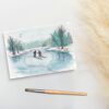 Foto van een ansichtkaart met een aquarelschildering van twee schaatsende mensen door a Girl in the Field