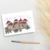 Foto van een ansichtkaart met een aquarelschildering van 4 mussen met kerstmutjes op door a Girl in the Field